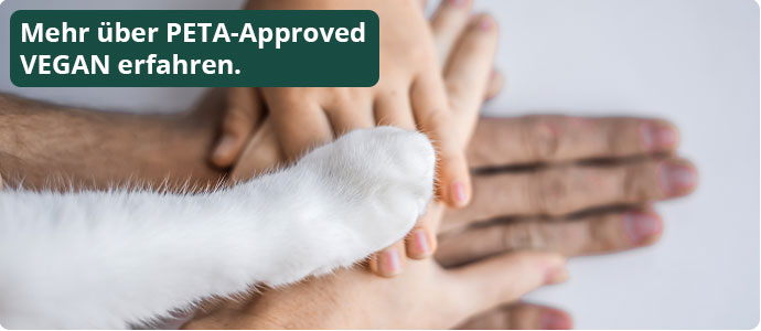 Mehr über PETA-Approved VEGAN erfahren. Mehrere Hände und eine Tierpfote übereinander