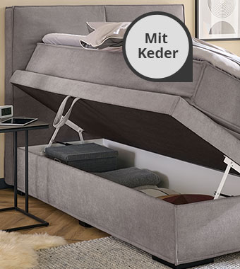 Graues Boxspringbett mit Keder und Bettkasten