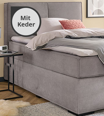Graues Boxspringbett mit Keder
