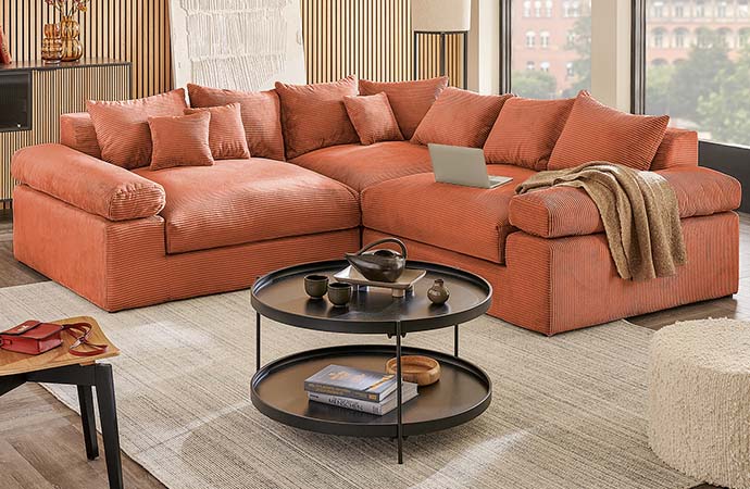 Ecksofa in rostrot mit Cord-Bezug