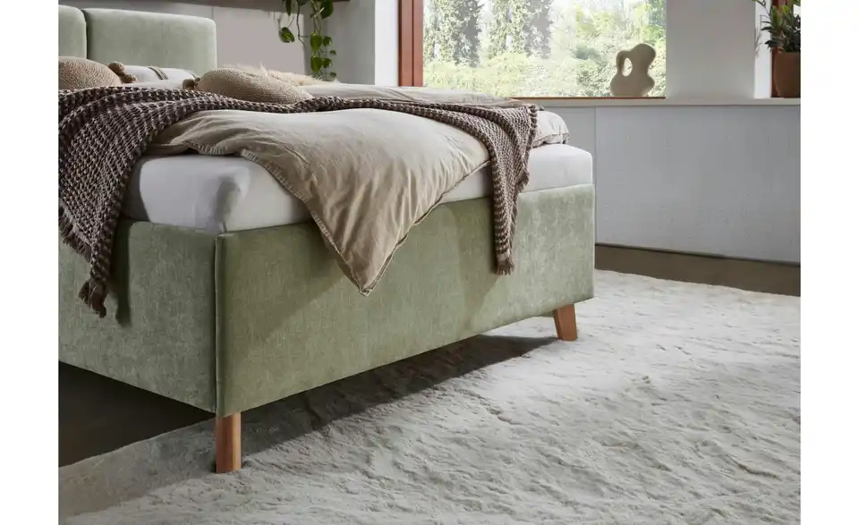 Polsterbett Piano in hellgrün, in Wohnsituation